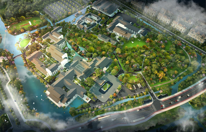 Aerial view of a campus with buildings, greenery, and waterways.