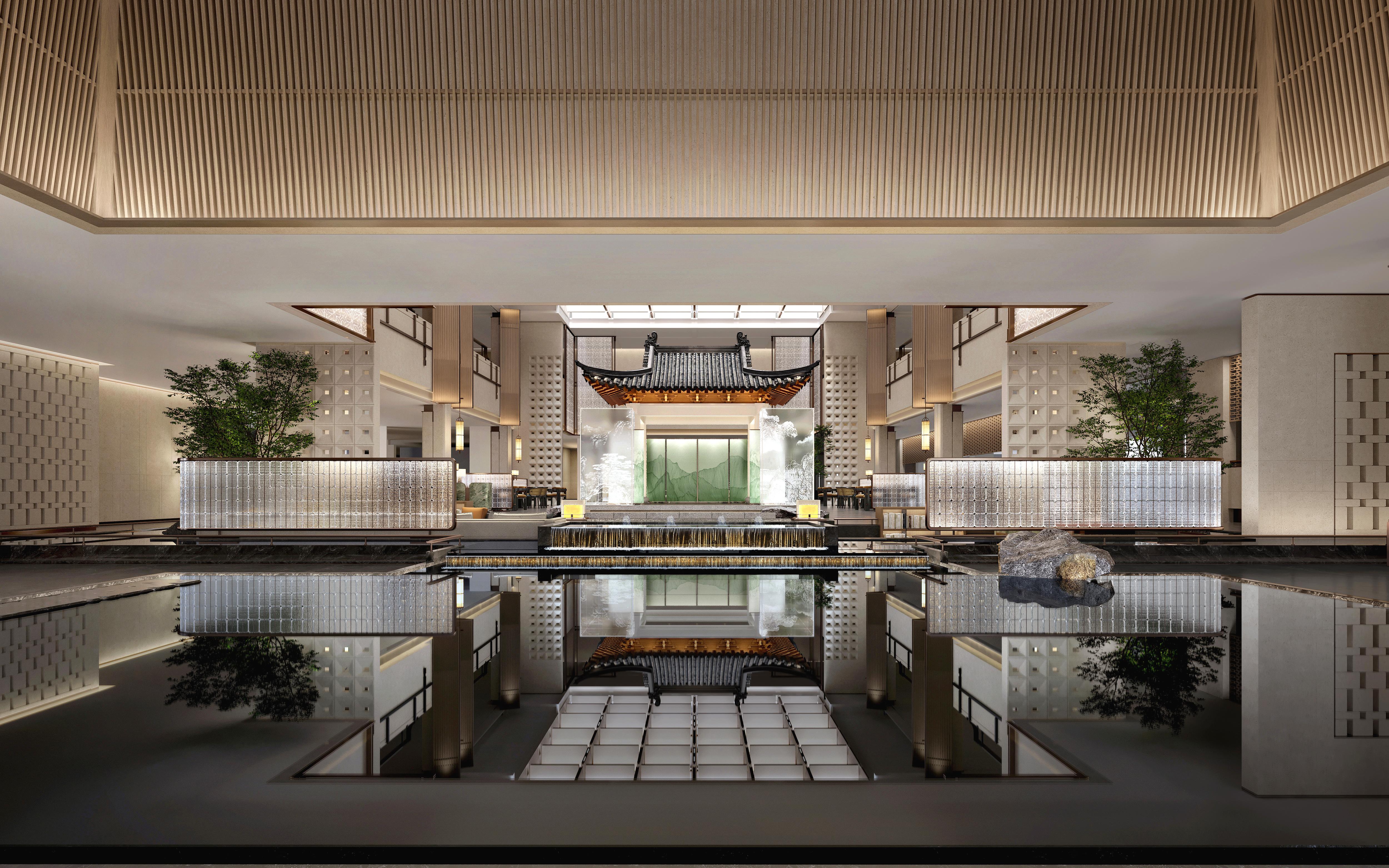 Modern indoor pool area with reflective water surface and decorative elements.