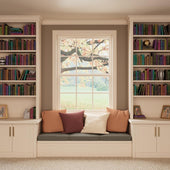 Bookshelves with colorful books, a window seat with pillows, and decorative items in a cozy room.