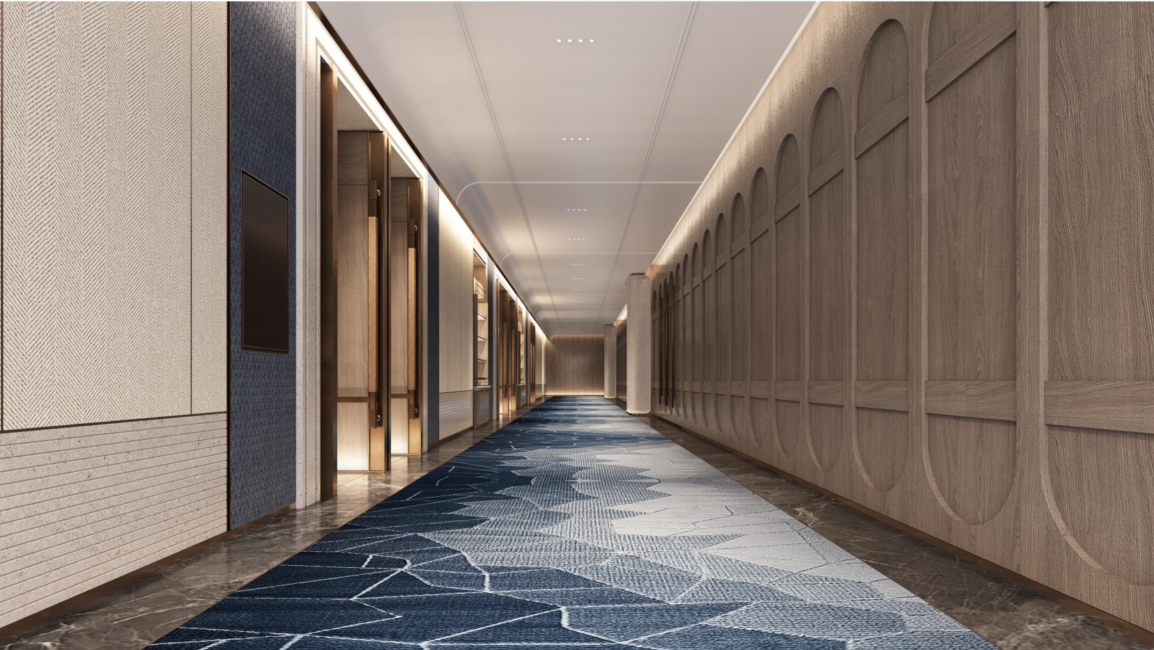 Long hallway with geometric patterned carpet and decorative wall panels.