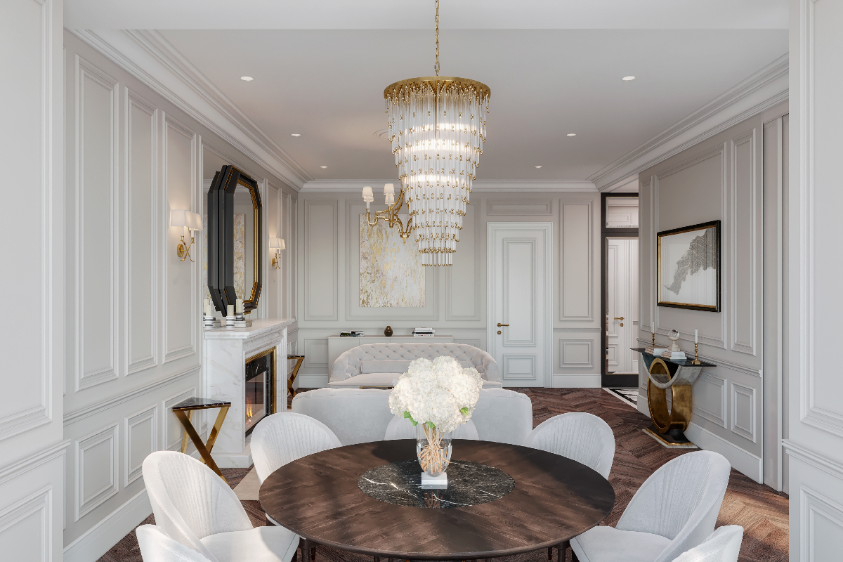 Elegant dining room with a chandelier, round table, and white chairs.