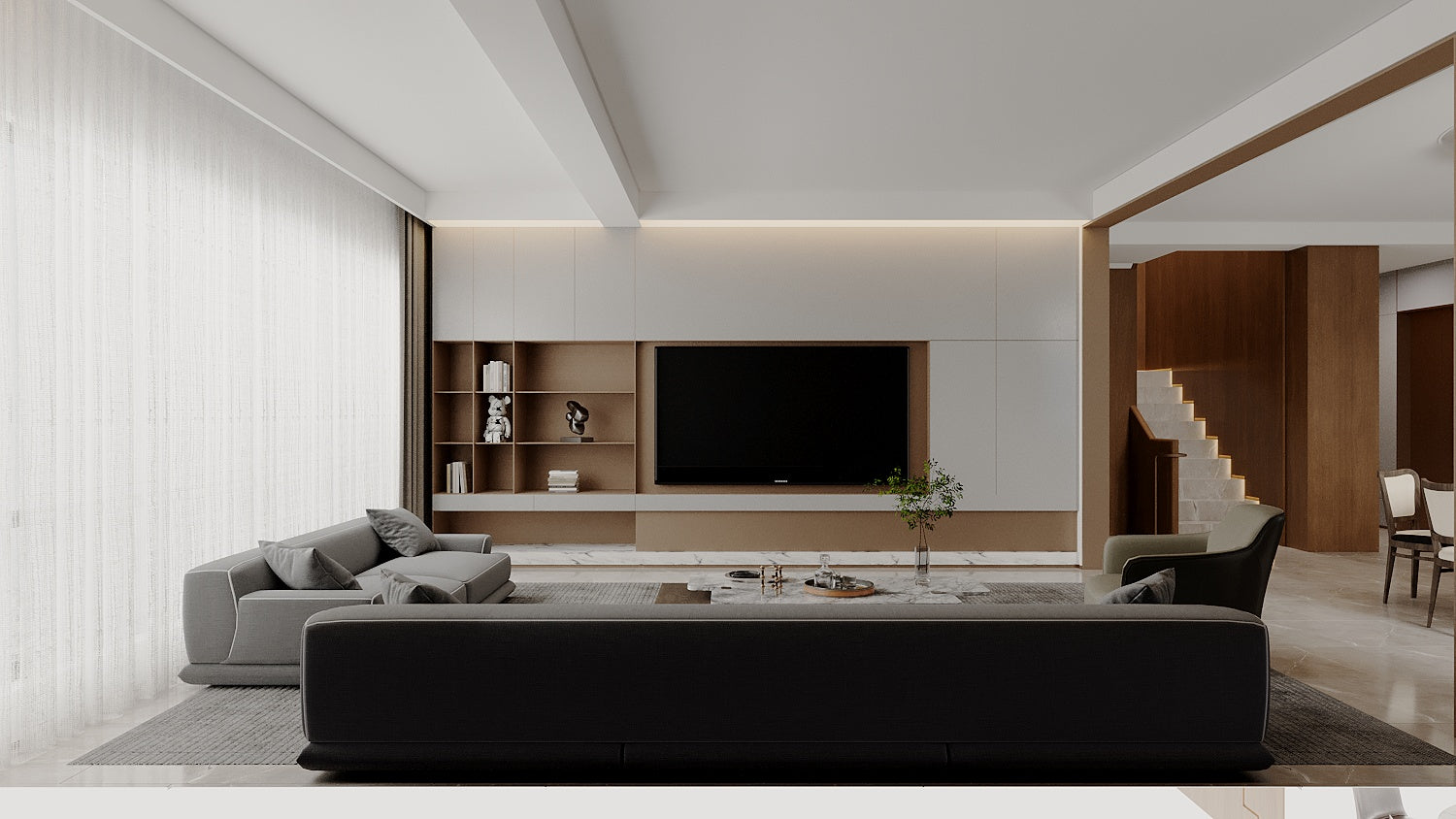 Modern living room with a black sofa, gray rug, and white walls.