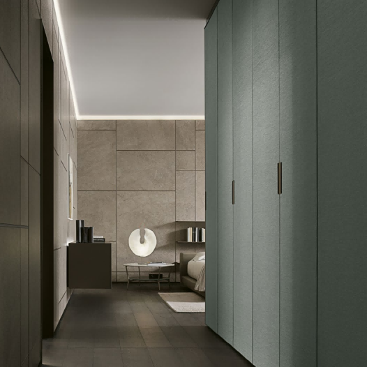 Modern interior design with gray textured wall and wooden door handle.