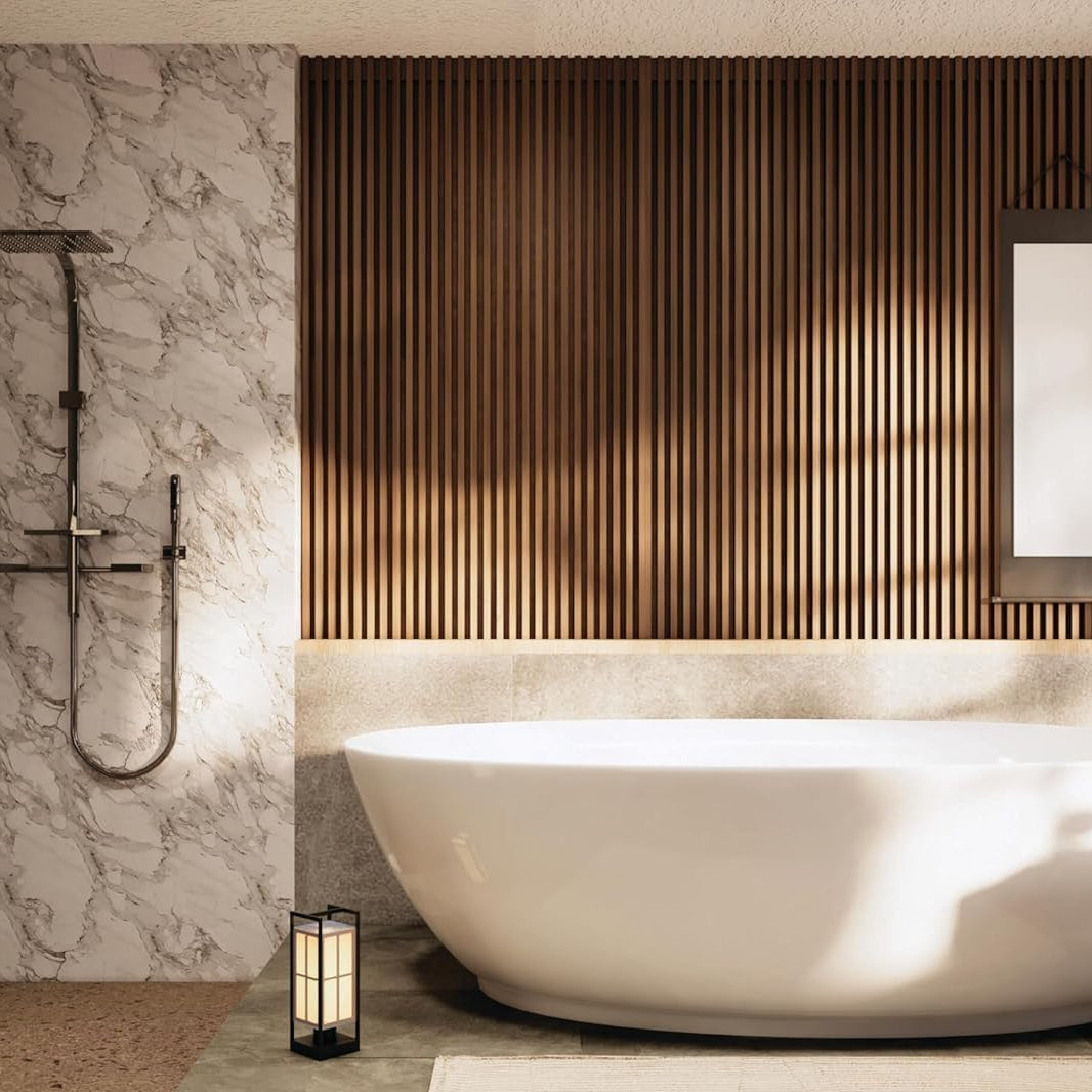 Modern bathroom with a white freestanding bathtub, marble wall, and wooden panel.