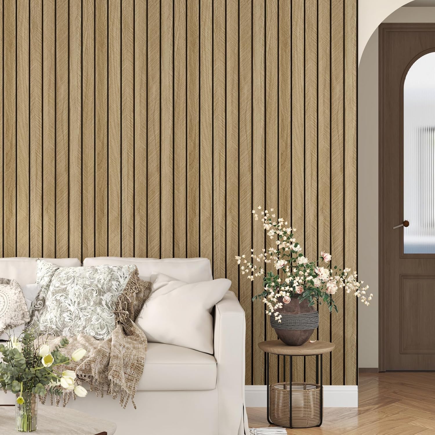 Living room with striped wallpaper, white sofa, and decorative elements.
