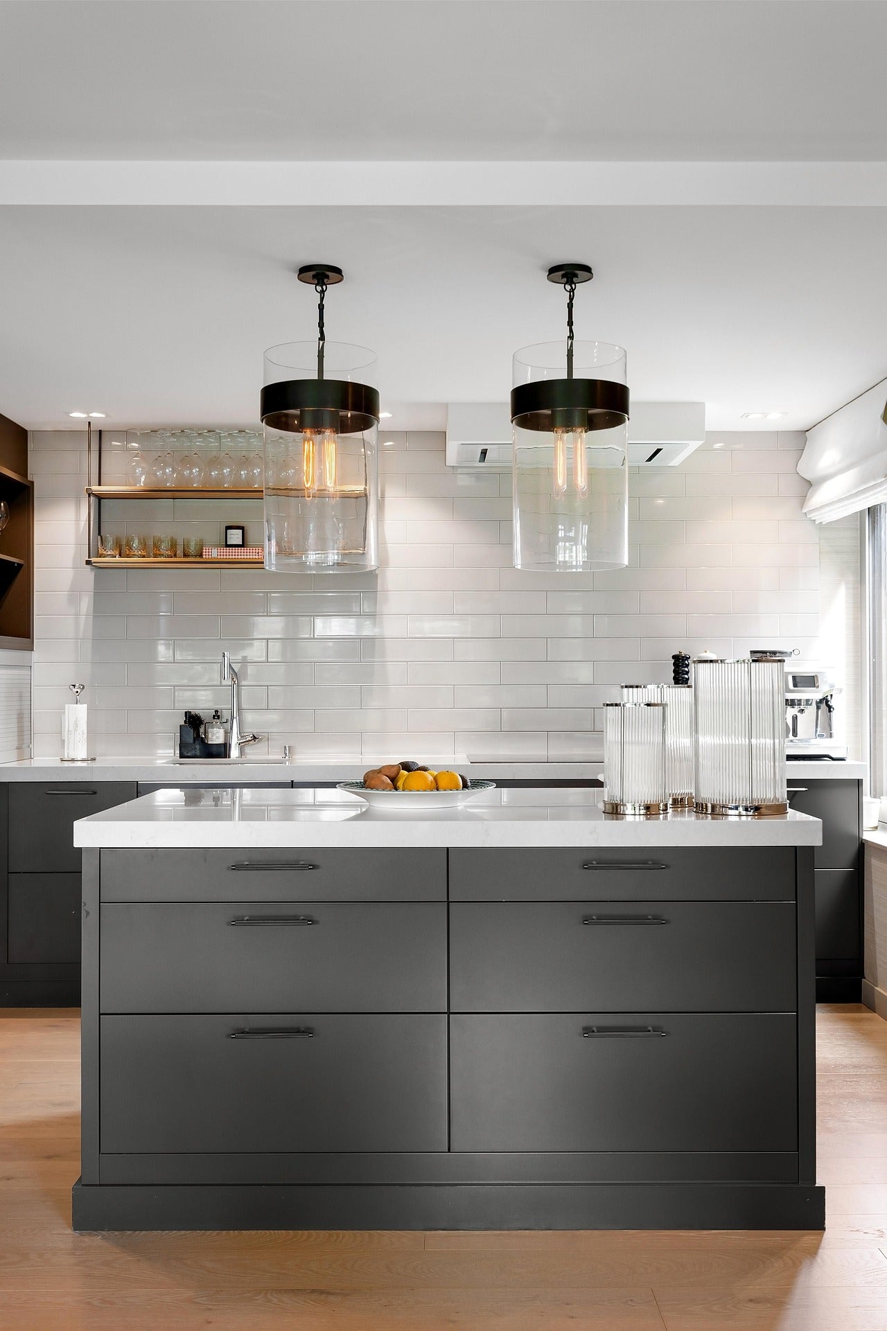Modern kitchen with gray island and white countertops
