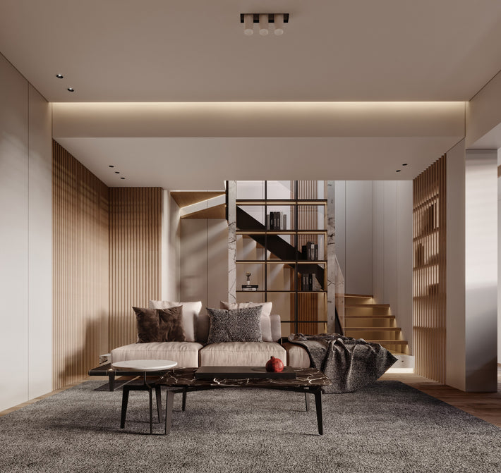 Modern living room with a sofa, coffee table, and bookshelf.