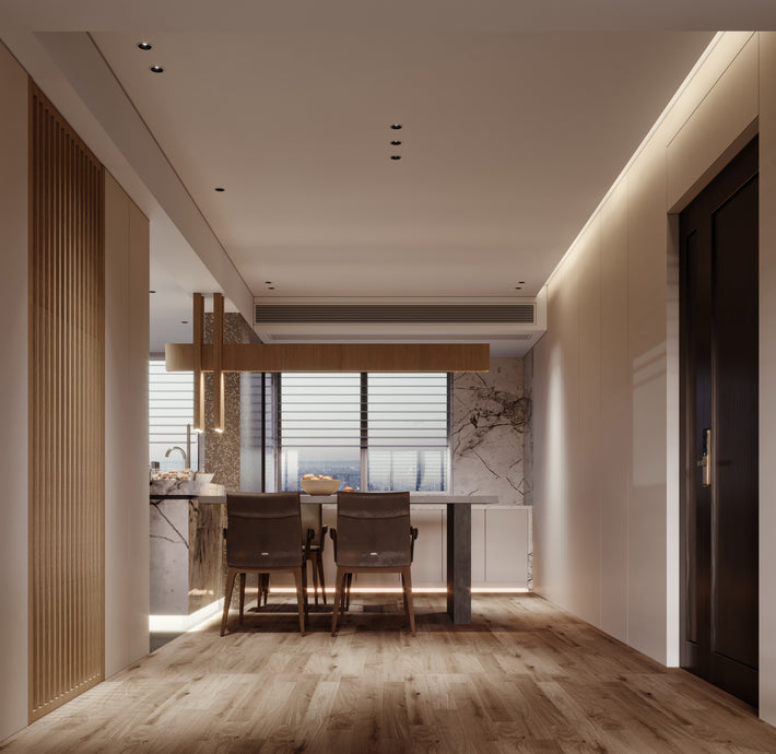 Modern interior design of a hallway leading to a kitchen with marble countertops.