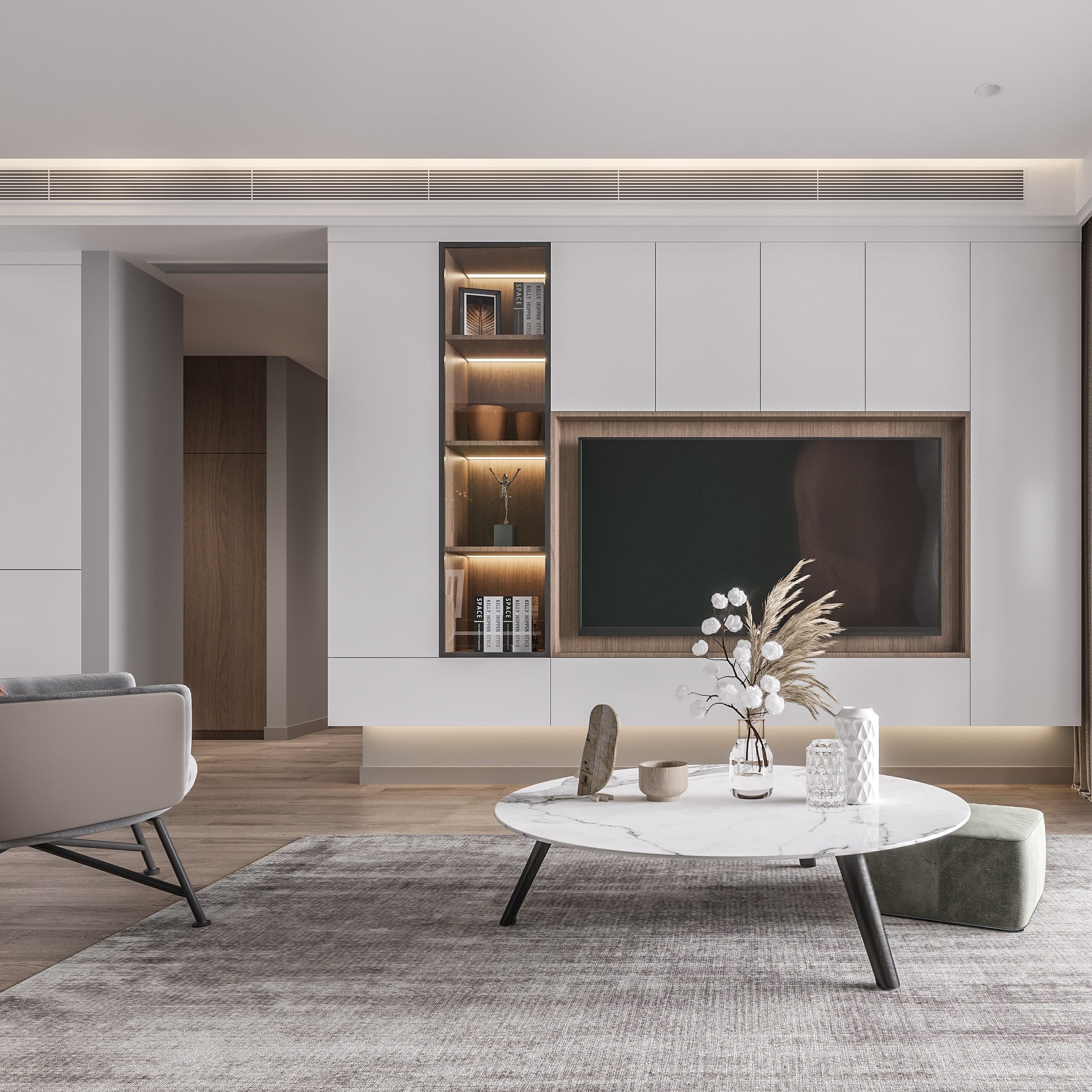 Modern living room with a television unit, coffee table, and decorative elements.