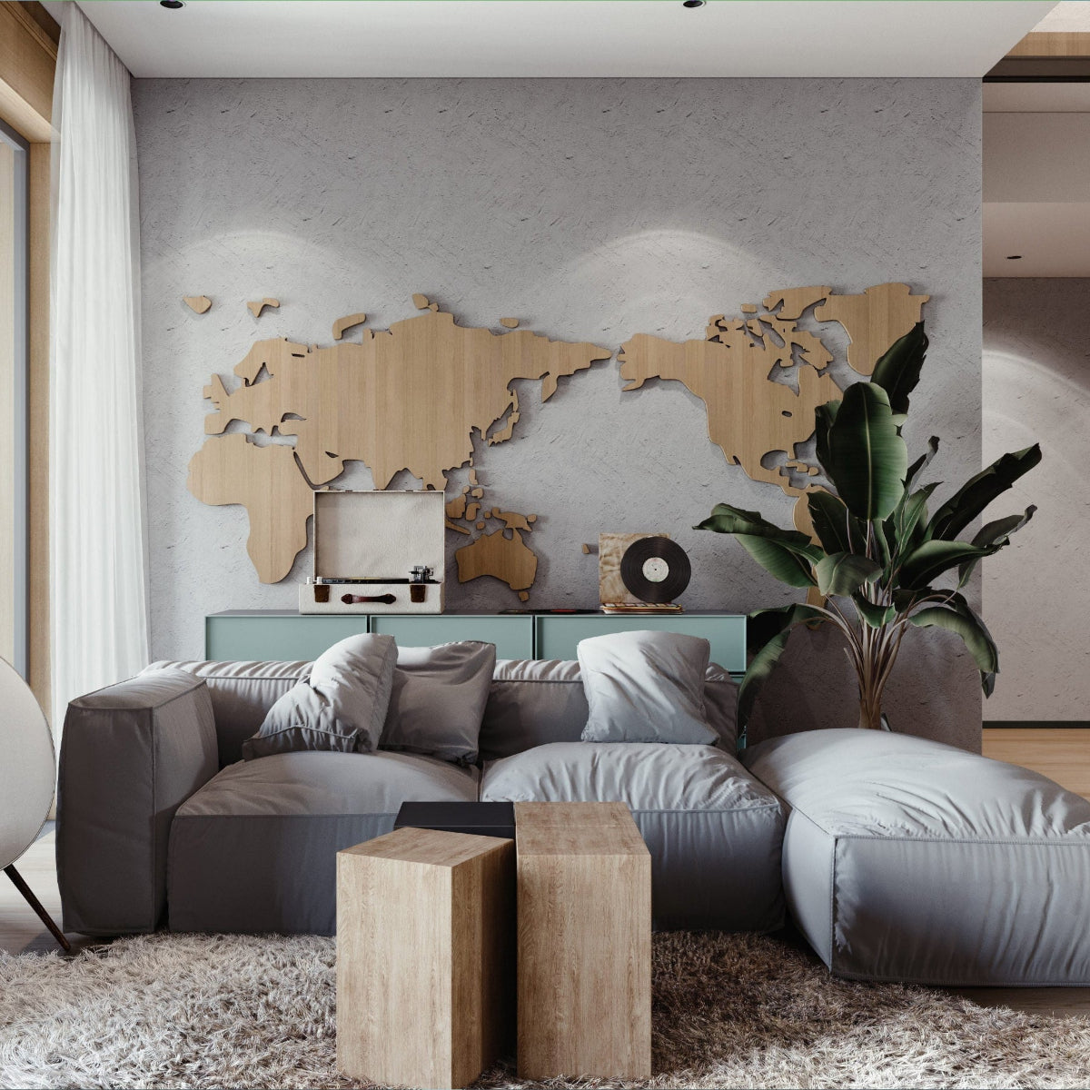Modern living room with a world map on the wall and a gray sofa.