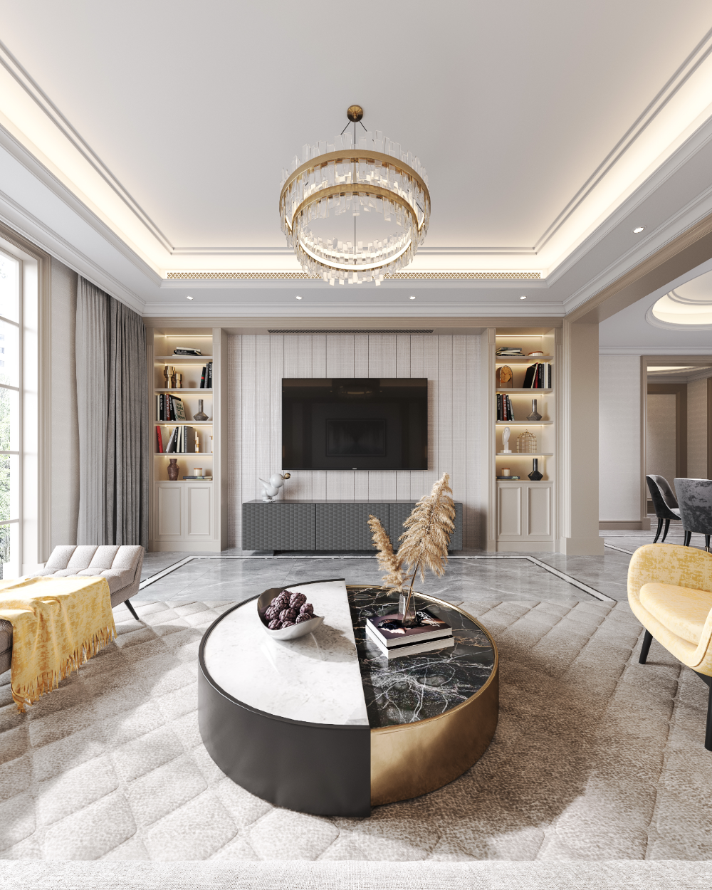 Modern living room with a round coffee table, chairs, and a chandelier.