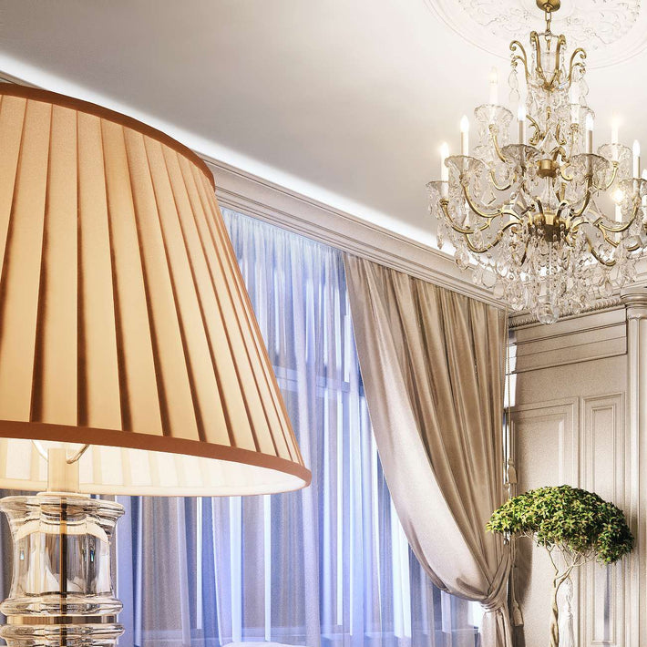 Luxurious bedroom with a bed, lamp, and television in a stylish room.