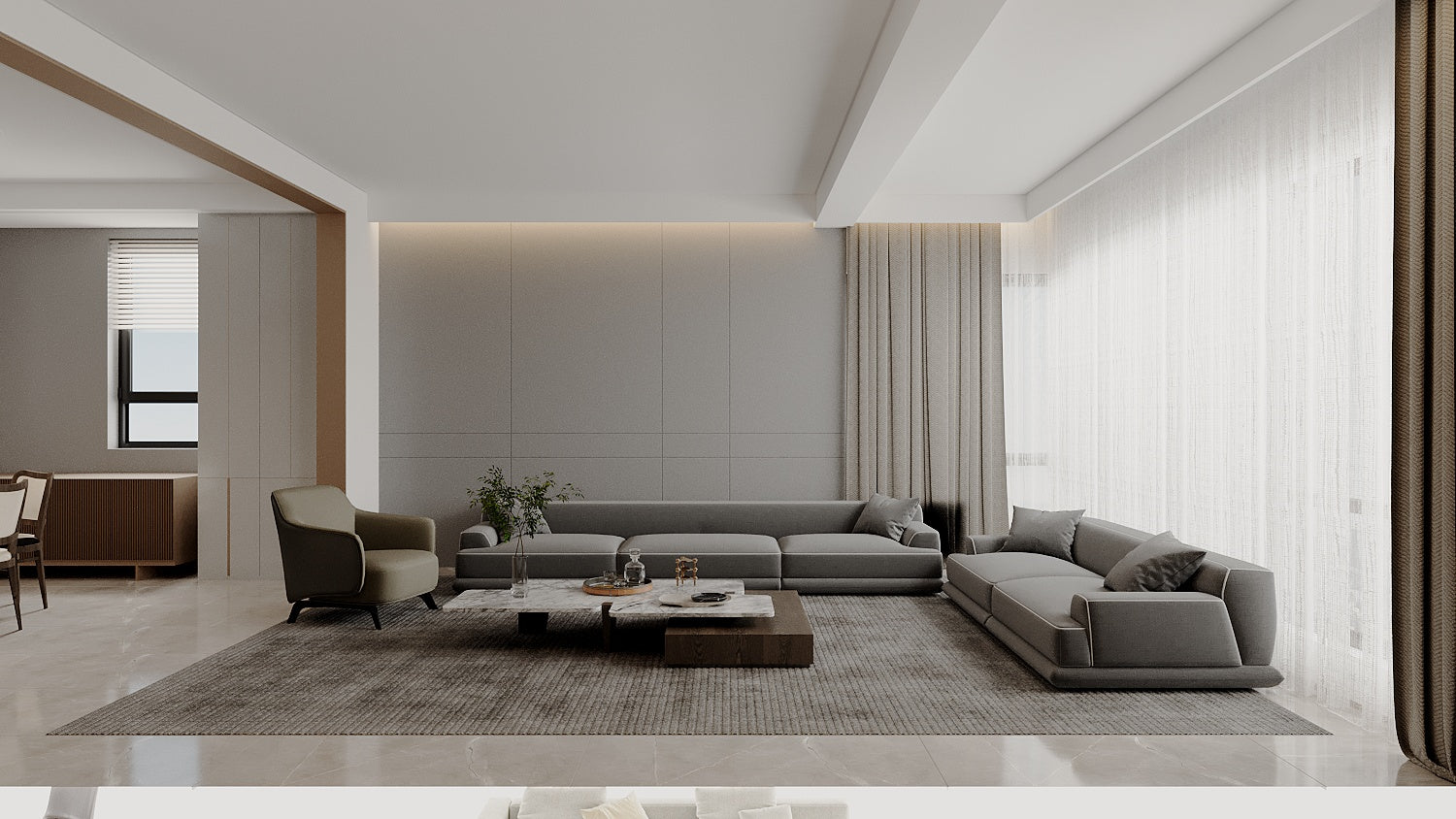 Modern living room with gray sofas, coffee table, and decorative items.