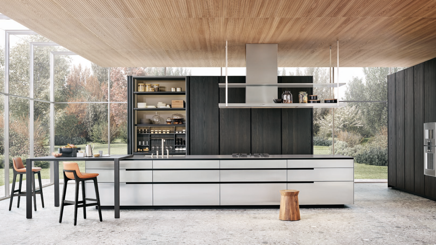 Modern kitchen with white island and black cabinets, large windows, and outdoor view.
