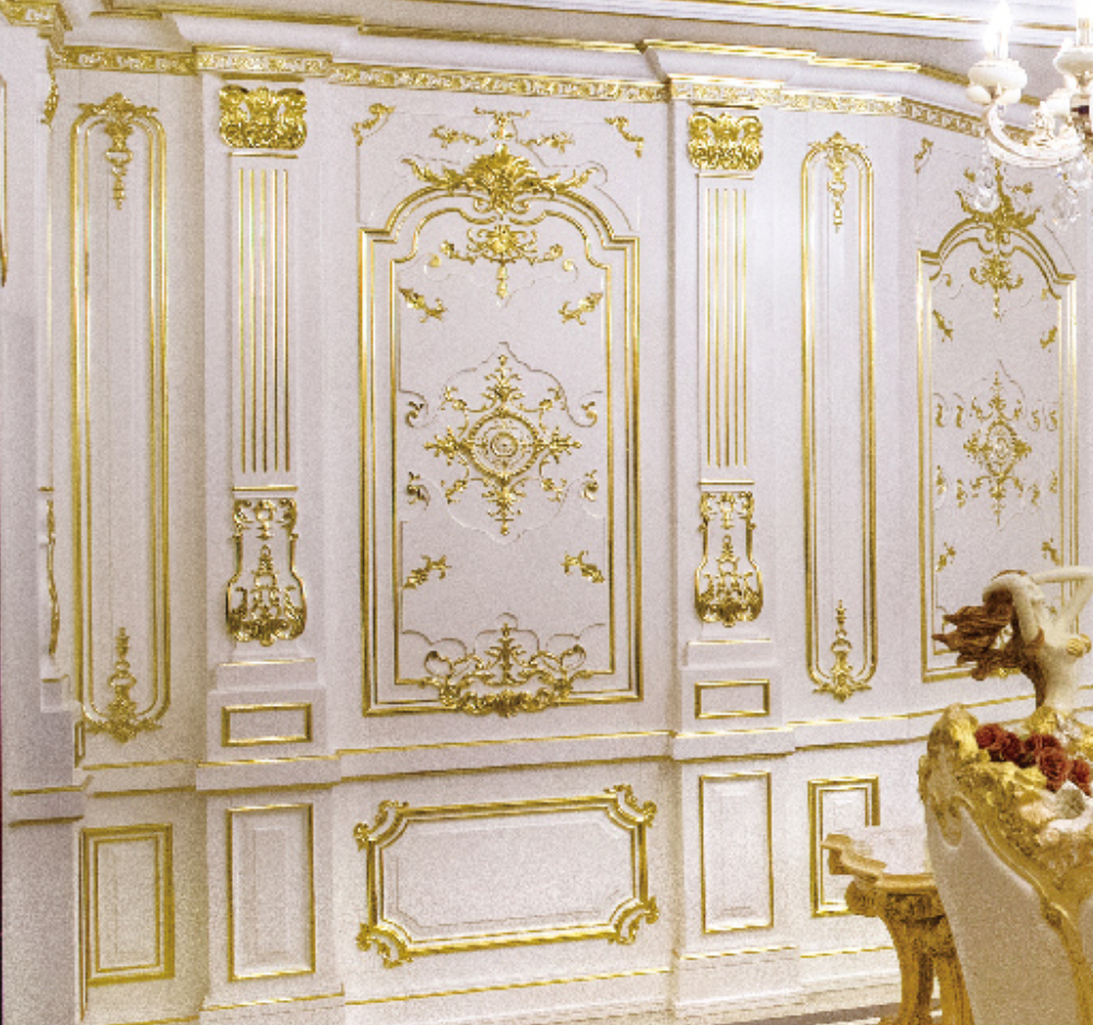 Decorative wall panel with gold intricate patterns in a luxurious setting.