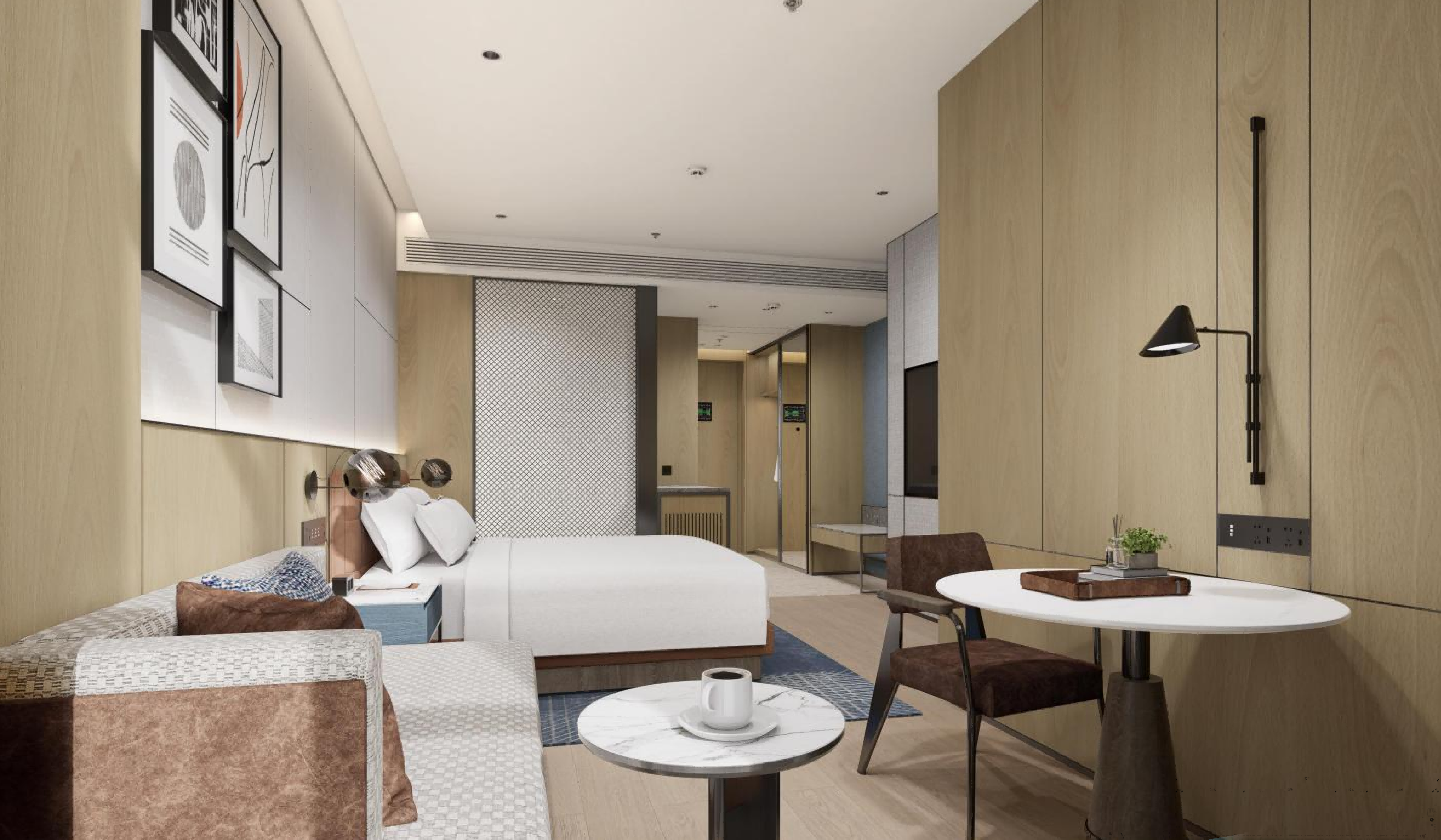Modern hotel room with bed, desk, and decor
