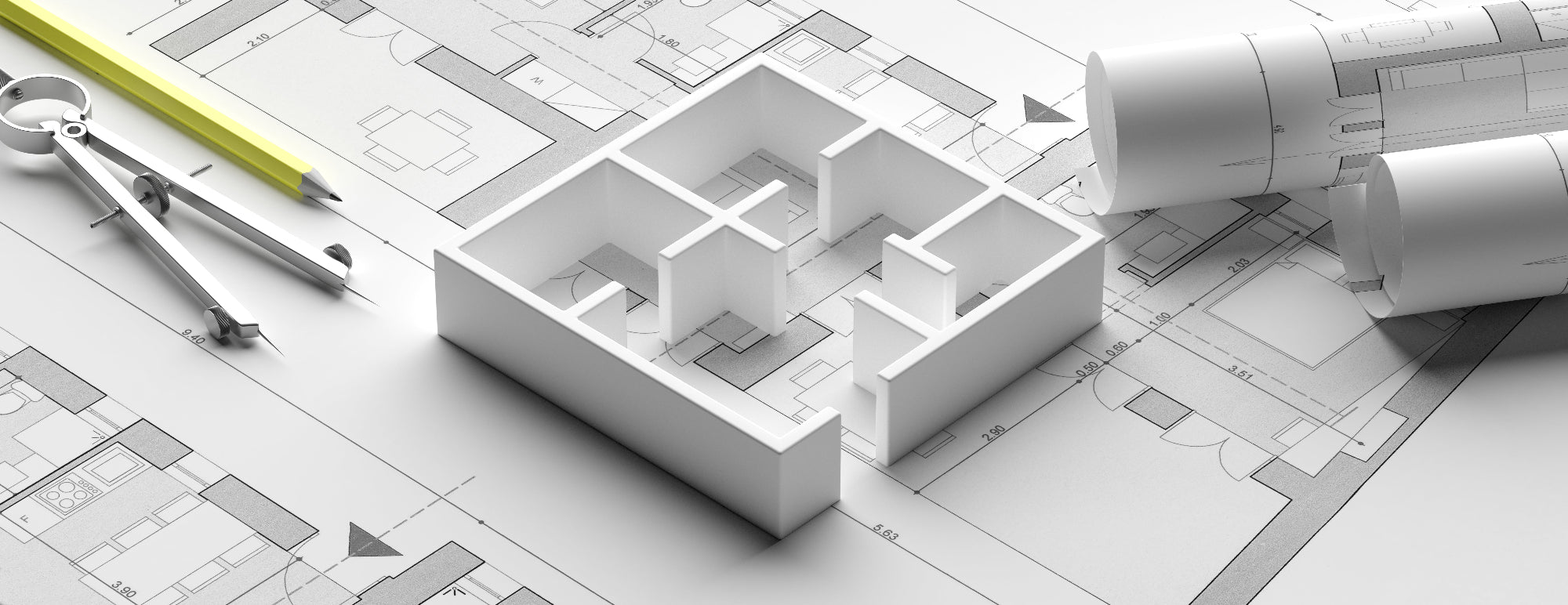 Architectural model of a building layout on blueprints with a pencil and compass.