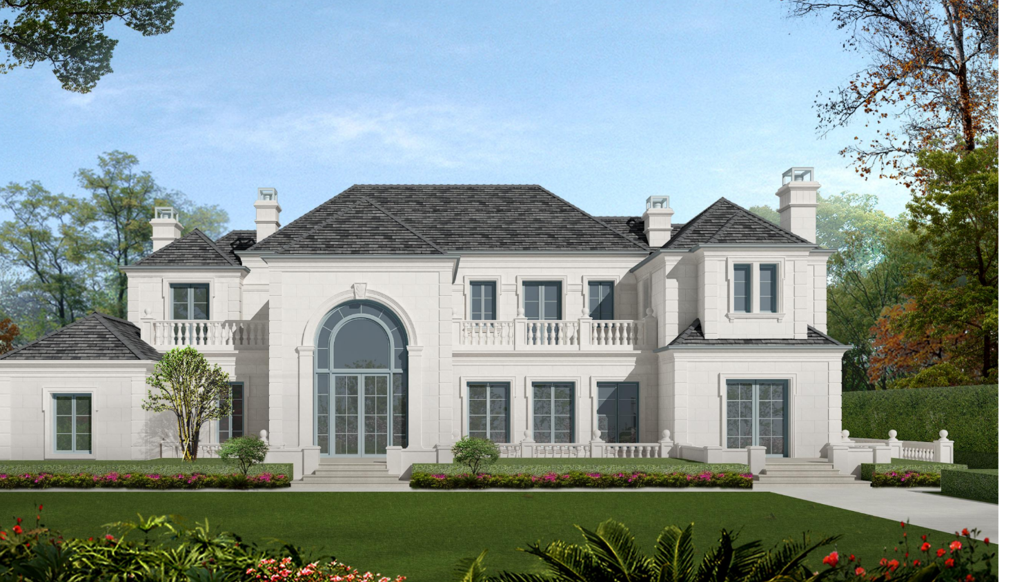 Stately white house with black roof against a blue sky